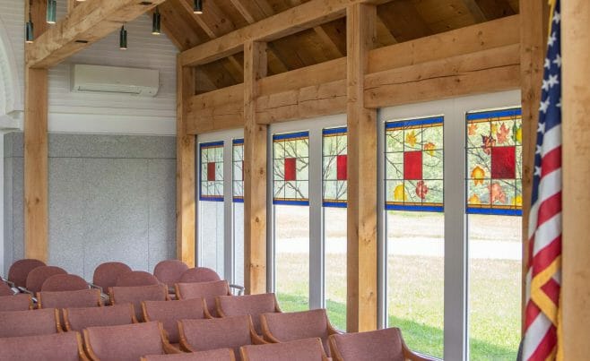 Stained Glass in the Interior of the Vermont Veterans Memorial Chapel. This church was made with Hemlock and Pine and features Girder Trusses.