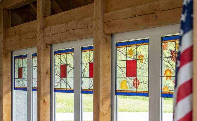 Stained Glass in the Interior of the Vermont Veterans Memorial Chapel. This church was made with Hemlock and Pine and features Girder Trusses.