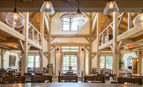 Interior of the Briar Barn Inn in Rowley, MA. The Monitor style barn features rough sawn Hemlock posts, beams, and trusses.