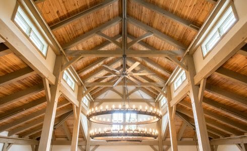 Interior of the Briar Barn Inn in Rowley, MA. The Monitor style barn features rough sawn Hemlock posts, beams, and trusses.