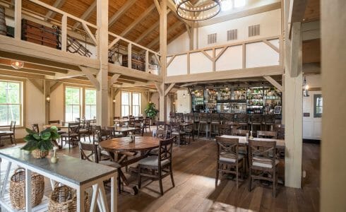 Interior of the Briar Barn Inn in Rowley, MA. The Monitor style barn features rough sawn Hemlock posts, beams, and trusses.