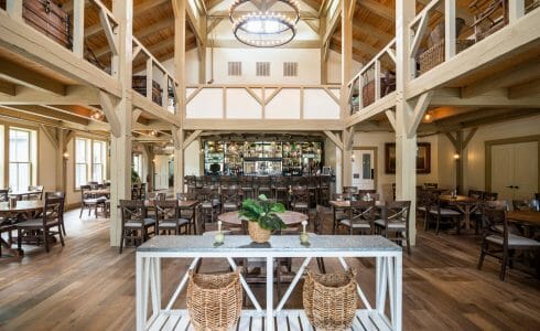 Interior of the Briar Barn Inn in Rowley, MA. The Monitor style barn features rough sawn Hemlock posts, beams, and trusses.