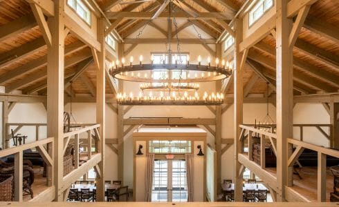 Interior of the Briar Barn Inn in Rowley, MA. The Monitor style barn features rough sawn Hemlock posts, beams, and trusses.