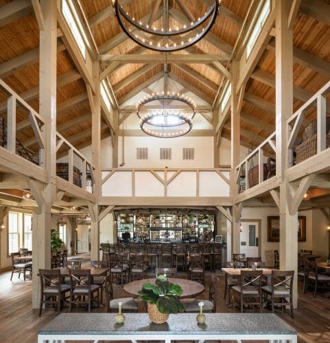 Interior of the Briar Barn Inn in Rowley, MA. The Monitor style barn features rough sawn Hemlock posts, beams, and trusses.