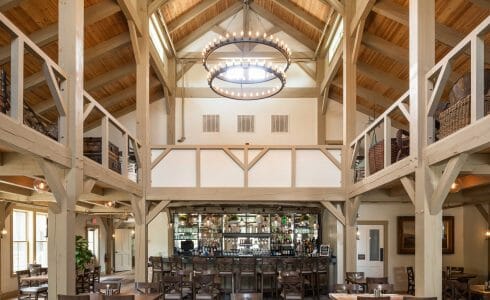 Interior of the Briar Barn Inn in Rowley, MA. The Monitor style barn features rough sawn Hemlock posts, beams, and trusses.