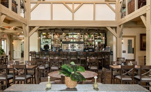 Interior of the Briar Barn Inn in Rowley, MA. The Monitor style barn features rough sawn Hemlock posts, beams, and trusses.