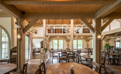 Interior of the Briar Barn Inn in Rowley, MA. The Monitor style barn features rough sawn Hemlock posts, beams, and trusses.