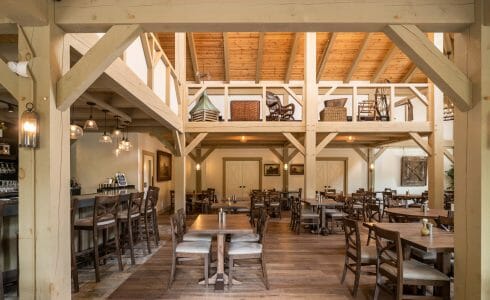 Interior of the Briar Barn Inn in Rowley, MA. The Monitor style barn features rough sawn Hemlock posts, beams, and trusses.