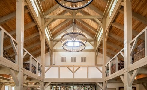 Interior of the Briar Barn Inn in Rowley, MA. The Monitor style barn features rough sawn Hemlock posts, beams, and trusses.