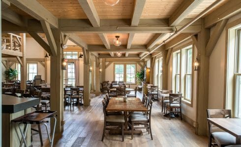 Interior of the Briar Barn Inn in Rowley, MA. The Monitor style barn features rough sawn Hemlock posts, beams, and trusses.