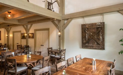 Interior of the Briar Barn Inn in Rowley, MA. The Monitor style barn features rough sawn Hemlock posts, beams, and trusses.