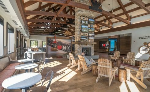 Interior of the Adirondack Welcome Center in Queensbury, NY featuring Douglas fir Glulam Heavy Timber Trusses with steel plates.