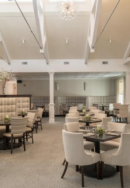 Modern, White heavy timber trusses with steel plates and tie bars in the Anya Restaurant in Thompson, CT.