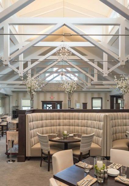 Modern, White heavy timber trusses with steel plates and tie bars in the Anya Restaurant in Thompson, CT.