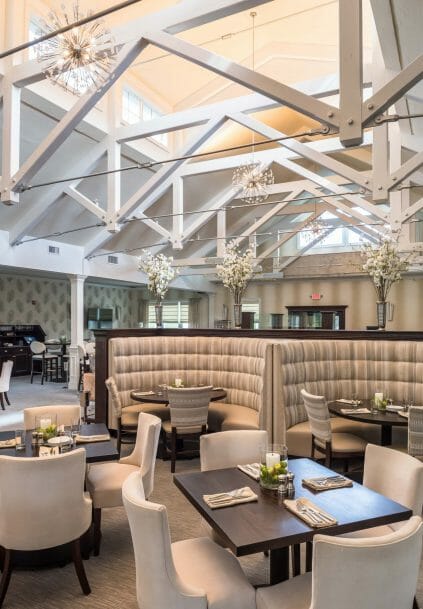 Modern, White heavy timber trusses with steel plates and tie bars in the Anya Restaurant in Thompson, CT.