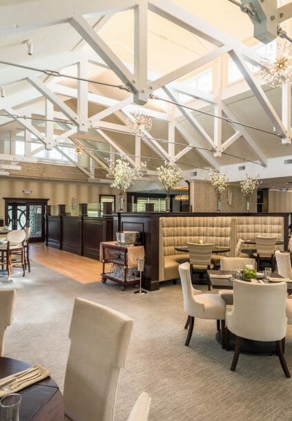 Modern, White heavy timber trusses with steel plates and tie bars in the Anya Restaurant in Thompson, CT.