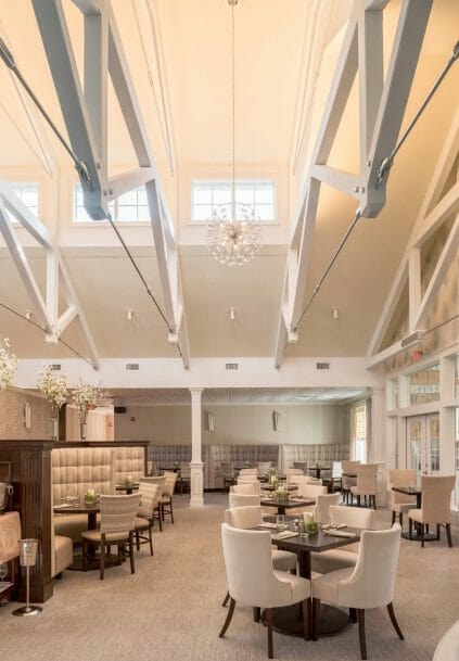 Modern, White heavy timber trusses with steel plates and tie bars in the Anya Restaurant in Thompson, CT.