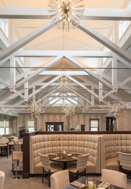 Modern, White heavy timber trusses with steel plates and tie bars in the Anya Restaurant in Thompson, CT.