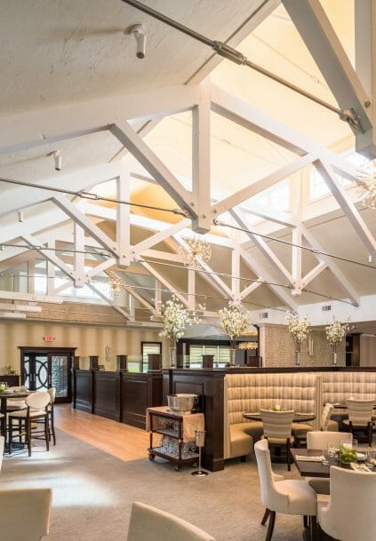 Modern, White heavy timber trusses with steel plates and tie bars in the Anya Restaurant in Thompson, CT.