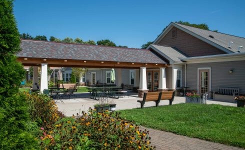 Heavy Timber Walkway with King Post Trusses in Doug fir, planed and chamfered with post bases with stone in Voorhees, NJ