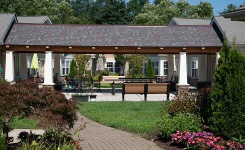 Heavy Timber Walkway with King Post Trusses in Doug fir, planed and chamfered with post bases with stone in Voorhees, NJ