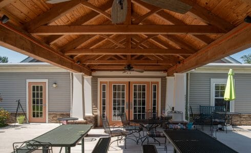 Heavy Timber Walkway with King Post Trusses in Doug fir, planed and chamfered with post bases with stone in Voorhees, NJ