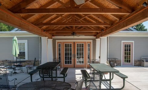 Heavy Timber Walkway with King Post Trusses in Doug fir, planed and chamfered with post bases with stone in Voorhees, NJ