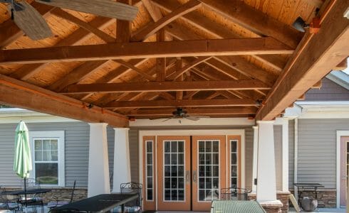 Heavy Timber Walkway with King Post Trusses in Doug fir, planed and chamfered with post bases with stone in Voorhees, NJ