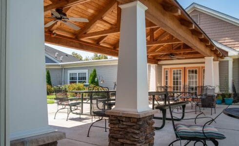 Heavy Timber Walkway with King Post Trusses in Doug fir, planed and chamfered with post bases with stone in Voorhees, NJ