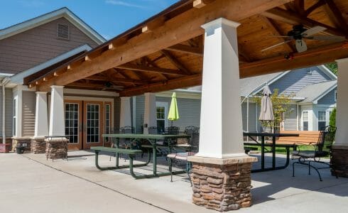 Heavy Timber Walkway with King Post Trusses in Doug fir, planed and chamfered with post bases with stone in Voorhees, NJ