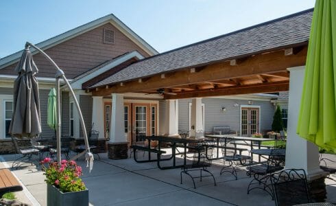 Heavy Timber Walkway with King Post Trusses in Doug fir, planed and chamfered with post bases with stone in Voorhees, NJ