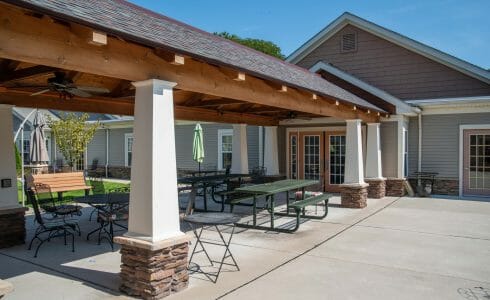 Heavy Timber Walkway with King Post Trusses in Doug fir, planed and chamfered with post bases with stone in Voorhees, NJ