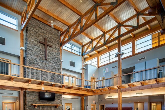 The Concord Christian Academy (previously the Centennial Senior Center) features cathedral ceilings and timber girder trusses.