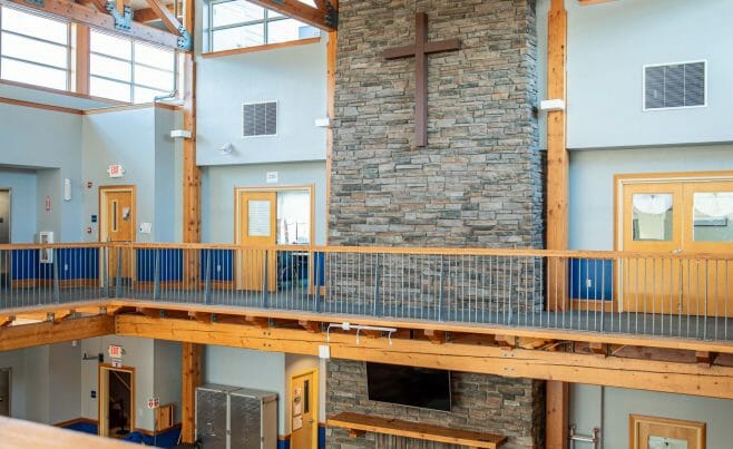 The Concord Christian Academy (previously the Centennial Senior Center) features cathedral ceilings and timber girder trusses.