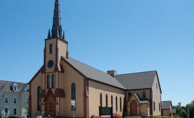 The completed interior of St. Michael's Church with arched trusses and steel tie rods