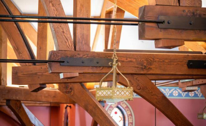 The completed interior of St. Michael's Church with arched trusses and steel tie rods