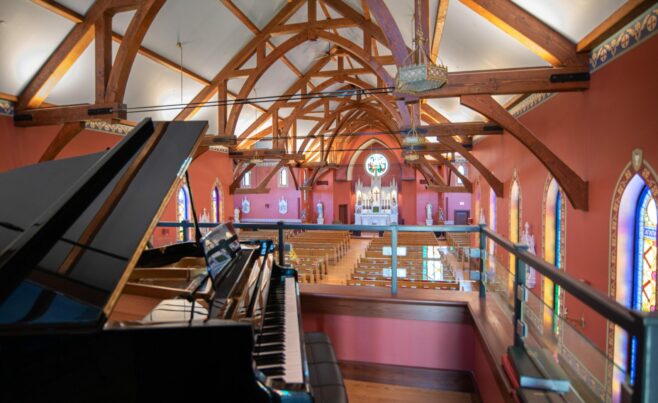 The completed interior of St. Michael's Church with arched trusses and steel tie rods