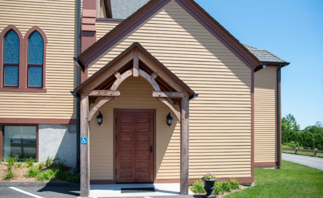 The completed interior of St. Michael's Church with arched trusses and steel tie rods