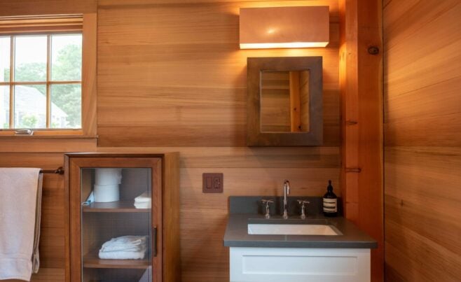 Interior of the Guest House on Martha's Vineyard Beach House that features Timber Posts and Beams, and Cedar cladding