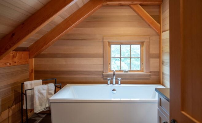 Interior of the Guest House on Martha's Vineyard Beach House that features Timber Posts and Beams, and Cedar cladding