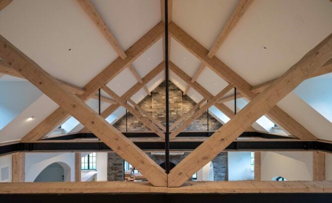 Interior of a home in New Hampshire with Hand Hewn Heavy Timber Trusses