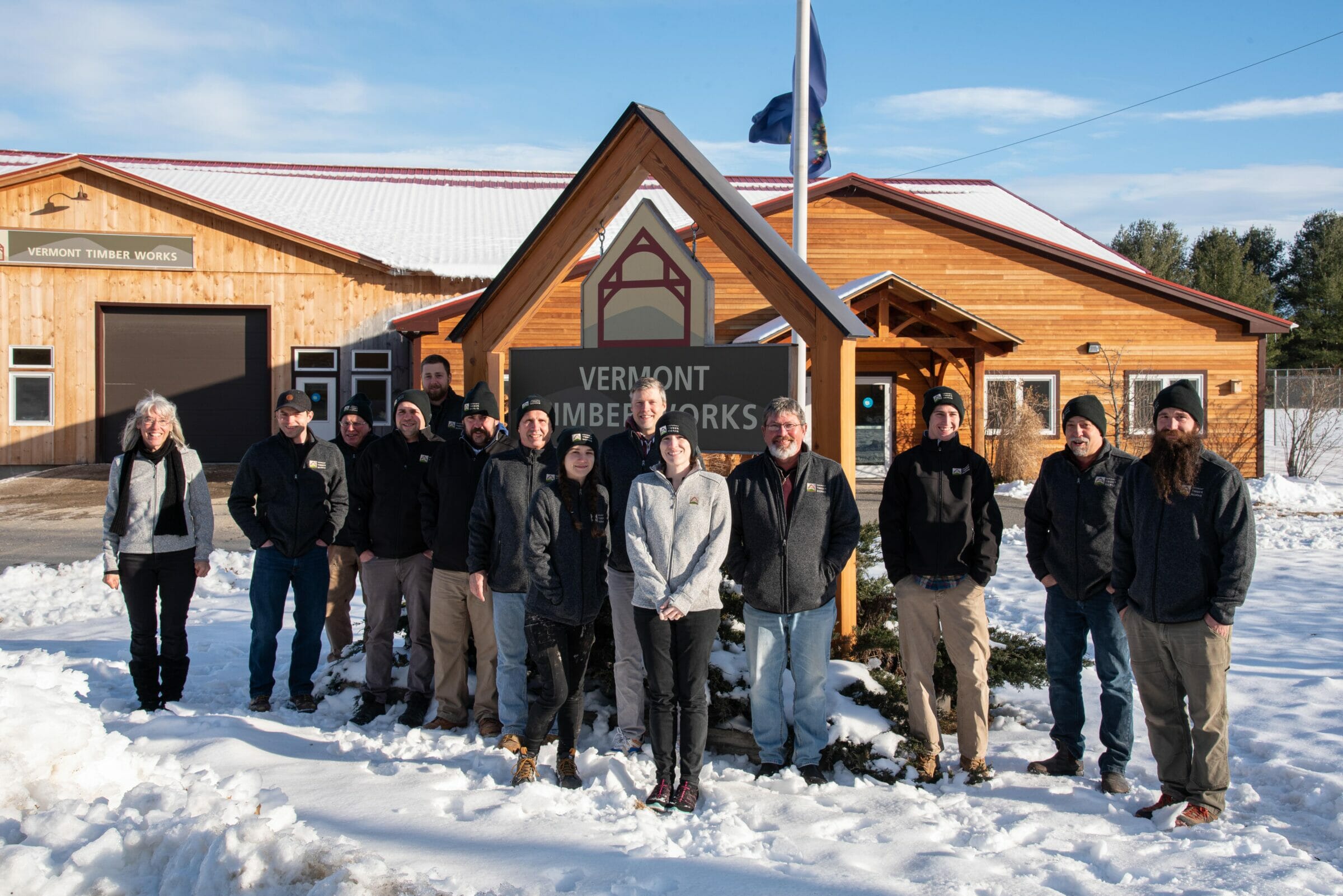 Vermont Timber Works Employees in front of the Company Sign