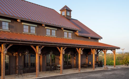 Hand hewn oak timbers covering an outdoor patio