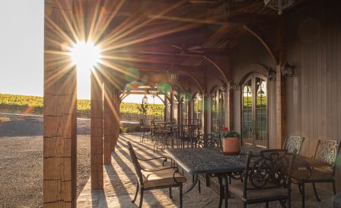 Sunset in the outdoor entertaining porch - hand hewn oak with dark stain.
