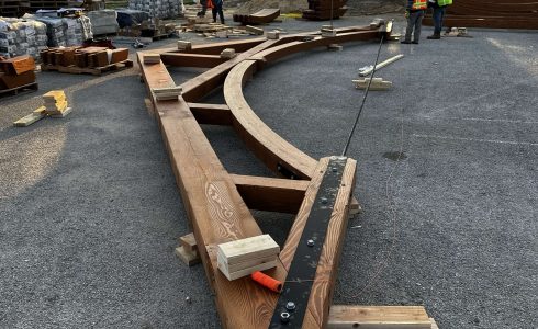 Heavy Timber Church Truss being assembled on the ground and prepared for lifting into place by by a crane