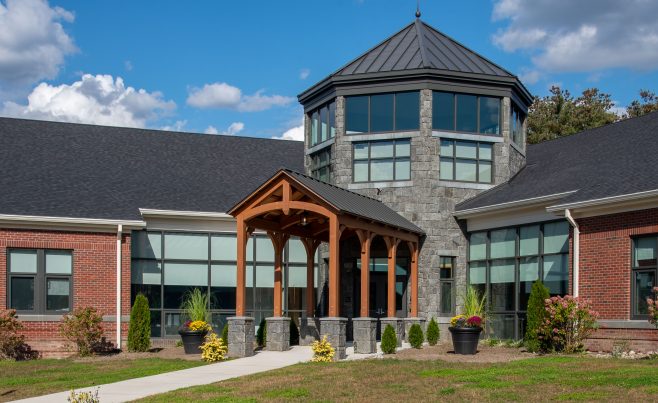 Side view of an arched timber frame entryway