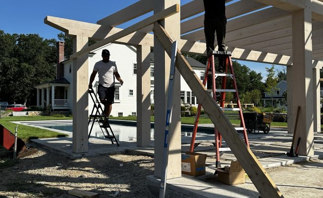 Pool house timber frame being assembled on site.