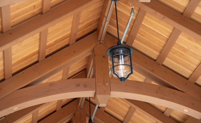 Cedar Timber entry truss showing 2x4 purlins and wood decking.