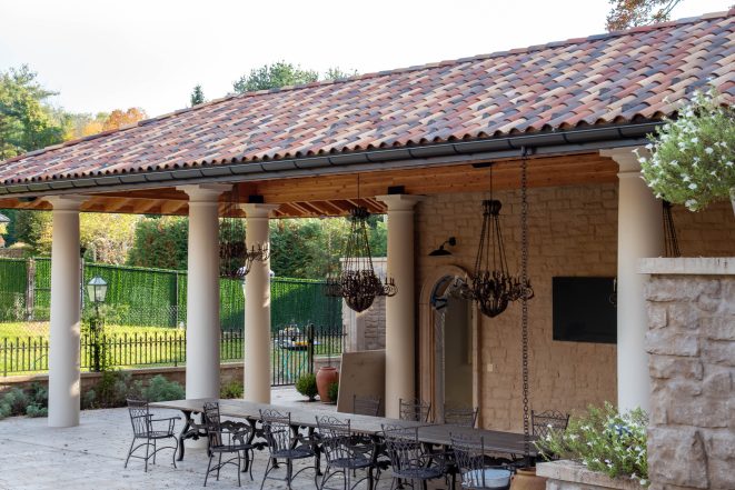 Mediterranean pavilion with shaped timber rafter ends.