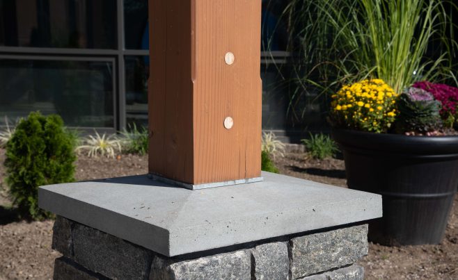 Timber post base with lateral stability